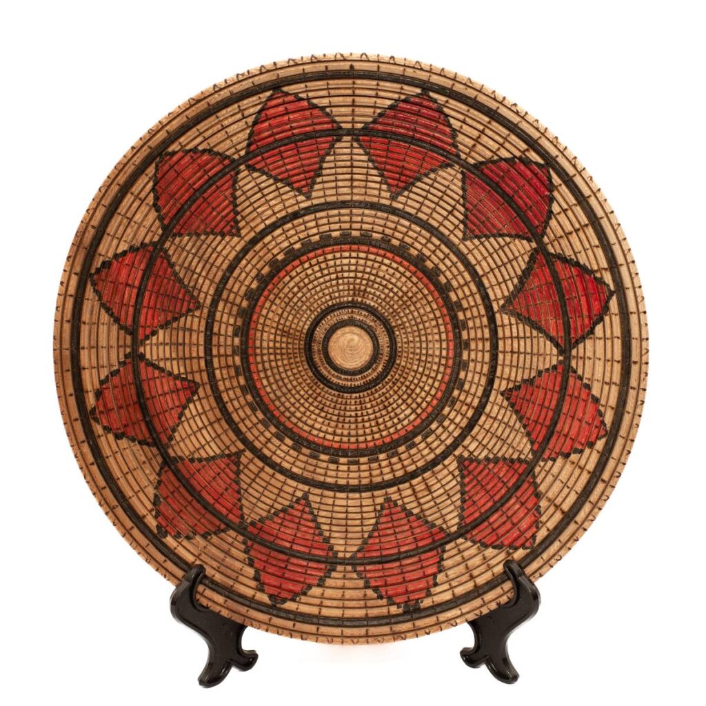 Round Wooden Plate with an Intricate Woven Pattern Design
