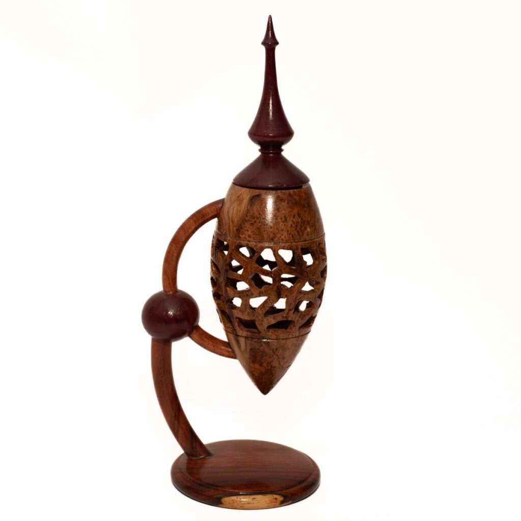 Ornate Wooden Vessel with Carved Openwork Design