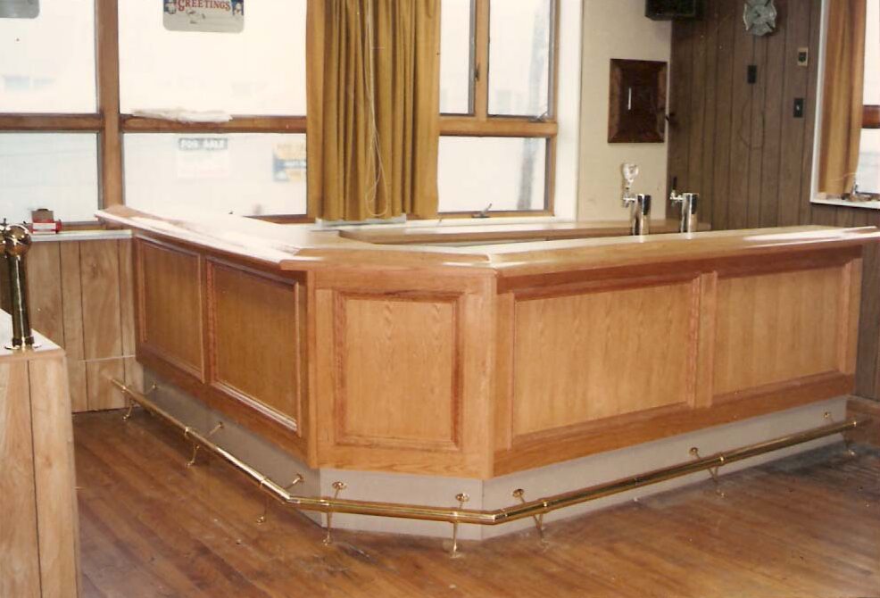 A Finished Wooden Bar with Paneled Sides