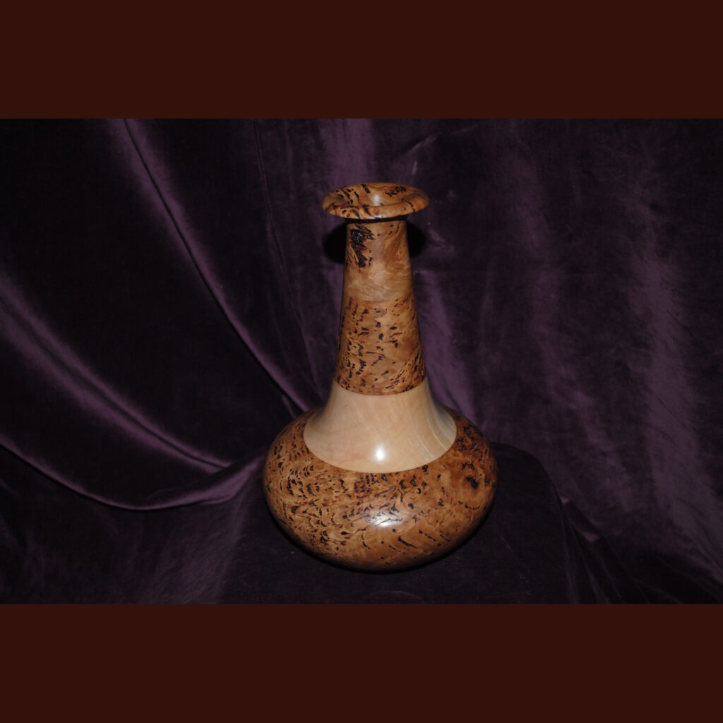 A Handcrafted Wooden Vase with a Rounded Base
