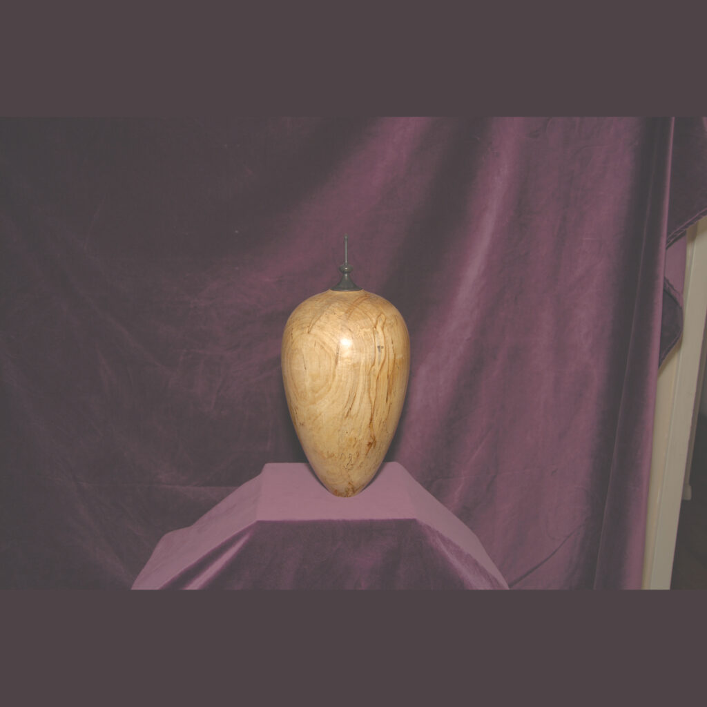 A Tall Elongated Wooden Vase